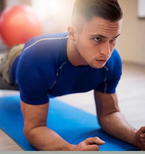 A man is doing an exercise on the floor.