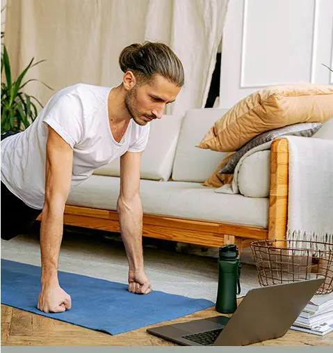 A woman is doing yoga on the floor