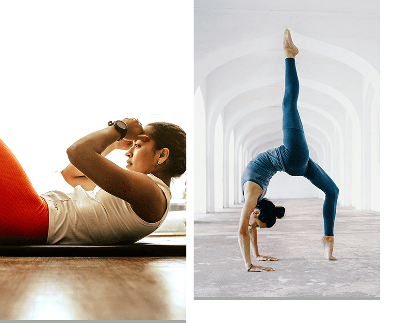 A man and woman doing yoga in the middle of an indoor setting.