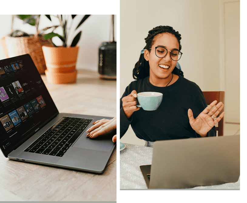 A woman sitting at a table with a laptop and cup.